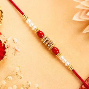 Pearl Beaded Rakhi – Traditional Red & Gold Elegance